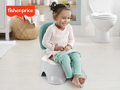 Fisher-Price 3-in-1 Toddler Toilet Training Potty Chair and Step Stool on the indoor background